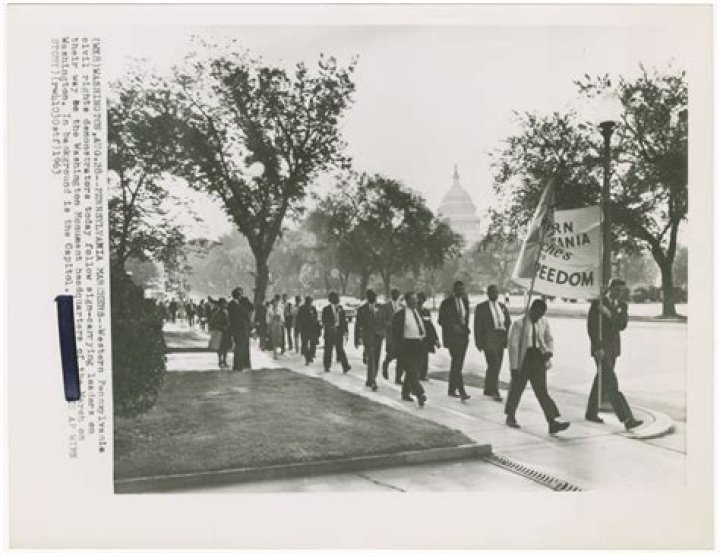 Demonstrators march to entrance of KKK national director Thomas Robb's