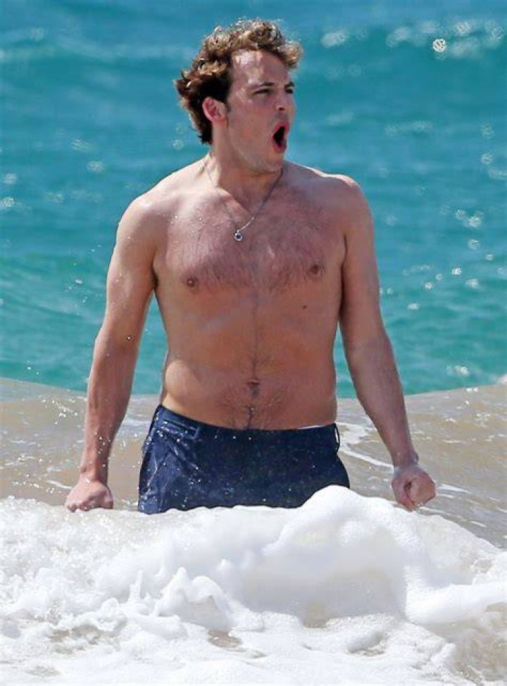 Shirtless Sam Claflin Frolics on Hawaiian Beach with Wife Laura Haddock